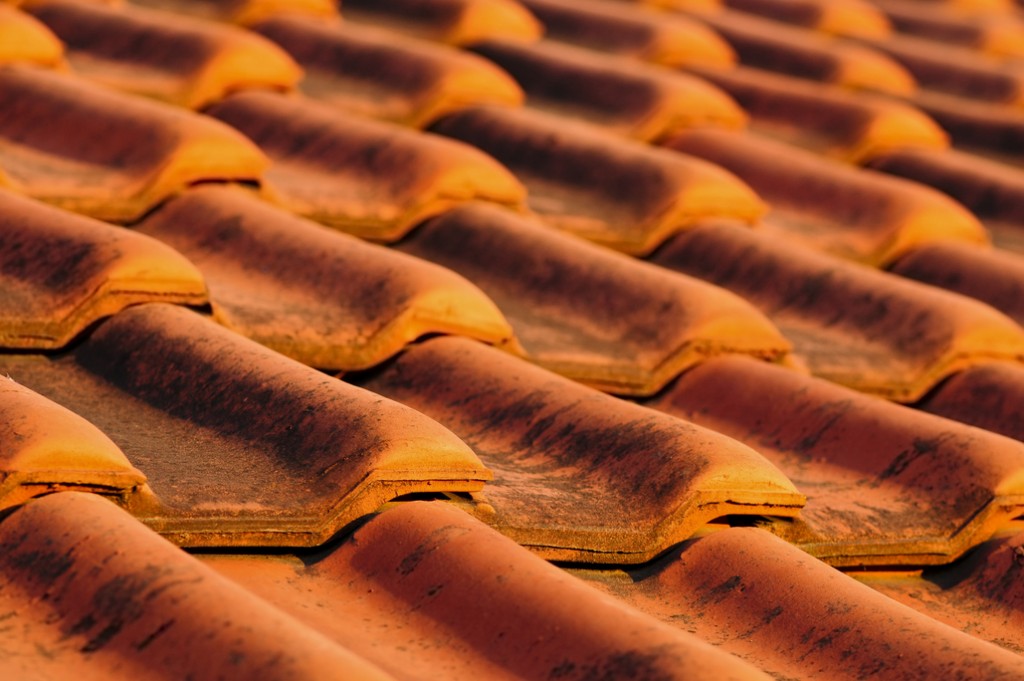 Red clay roof tiles to illustrate different types of residential roofs