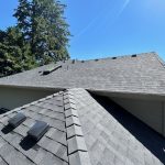 A new gray shingle roof on a home.